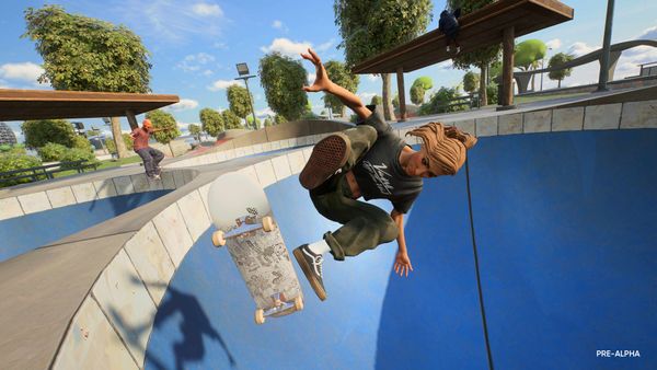 Skater doing a kickflip inside an empty skatepark pool.