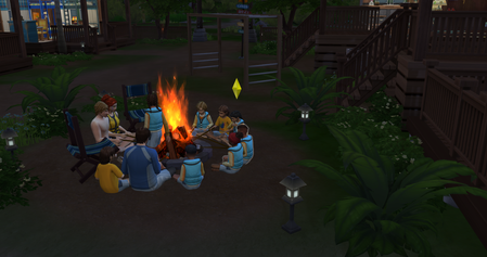 Sims and children around a campfire toasting marshmallows at night time