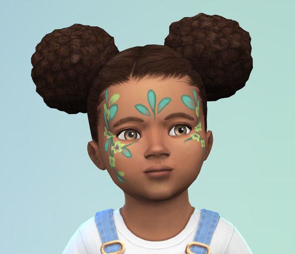 Image d'un bambin avec un maquillage floral dans des tons verts avec des touches de violet.